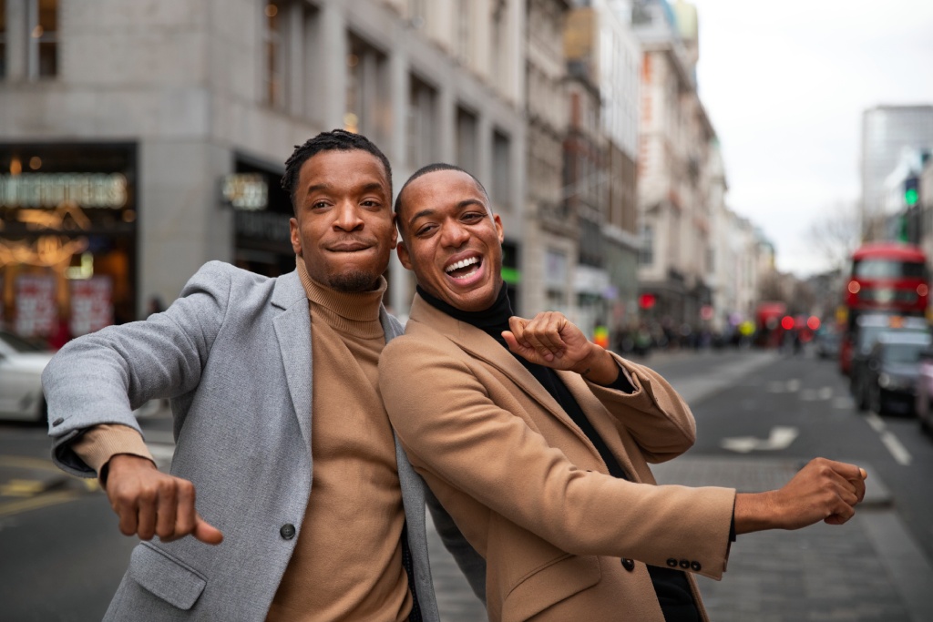 Gay Couple Being Affectionate Acting Goofy City Street